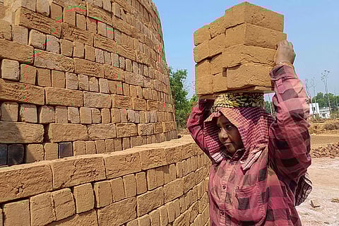 Woman at brick kiln