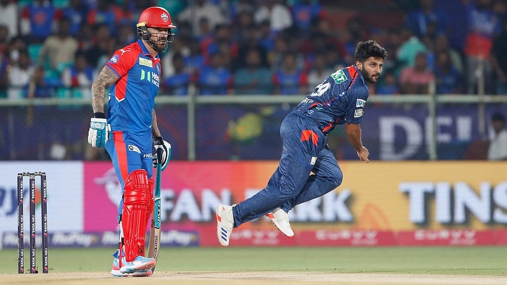 AP : Lucknow Super Giants' Shardul Thakur (right) bowls against Delhi Capitals in the Indian Premier League.
