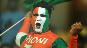 AP/R. Parthibhan : A Chennai Super Kings' Mahendra Singh Dhoni fans cheers during the Indian Premier League cricket match between Chennai Super Kings and Royal Challengers Bengaluru at M. A. Chidambaram Stadium in Chennai, India, Friday, March 28, 2025.