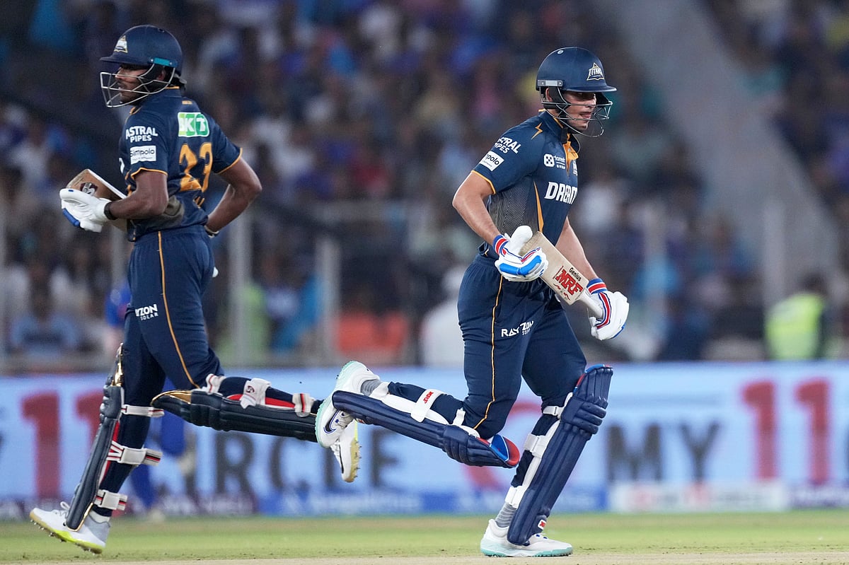 Gujarat Titans' captain Shubman Gill, right, and batting partner Sai Sudharsan run between the wickets to score during the Indian Premier League cricket match between Gujarat Titans and Mumbai Indians at Narendra Modi Stadium in Ahmedabad, India, Saturday, March 29, 2025. 

 - (AP Photo/Ajit Solanki)

