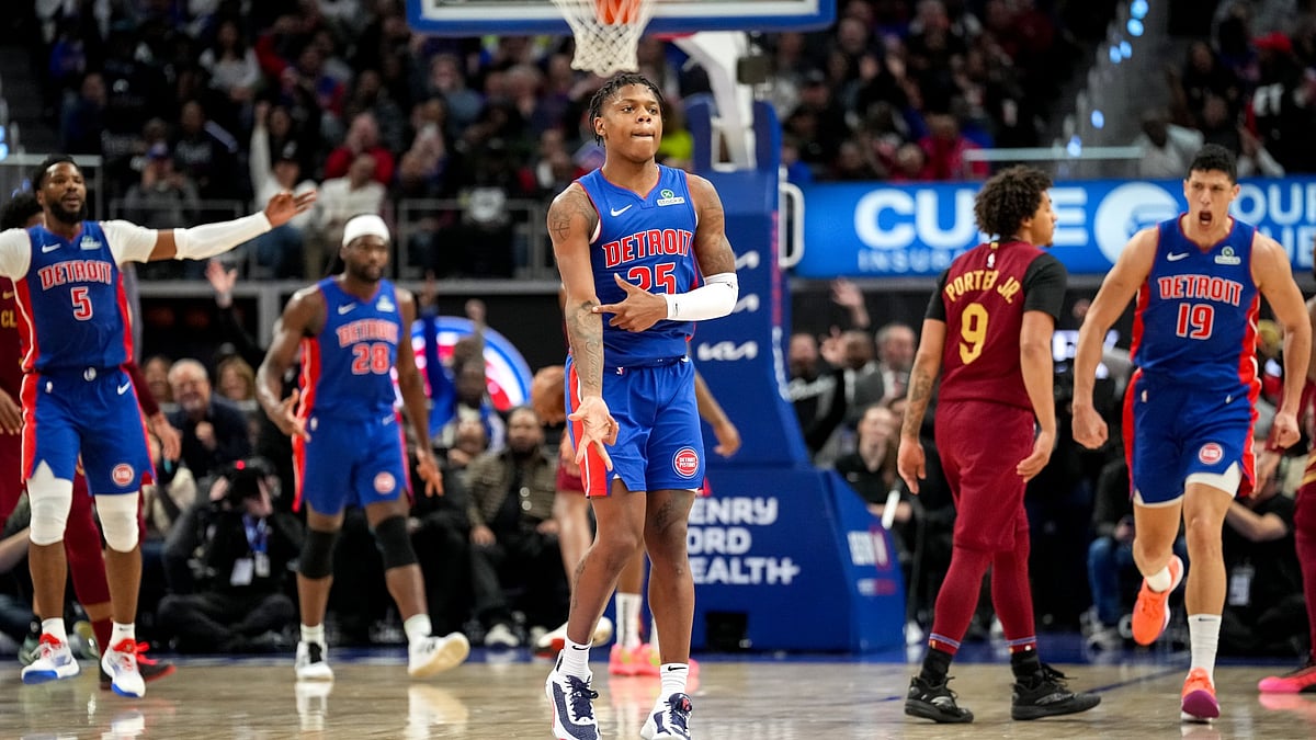 Marcus Sasser #25 of the Detroit Pistons reacts after making a 3-point basket against the Cleveland Cavaliers during the third quarter at Little Caesars Arena on March 28, 2025 in Detroit, Michigan.