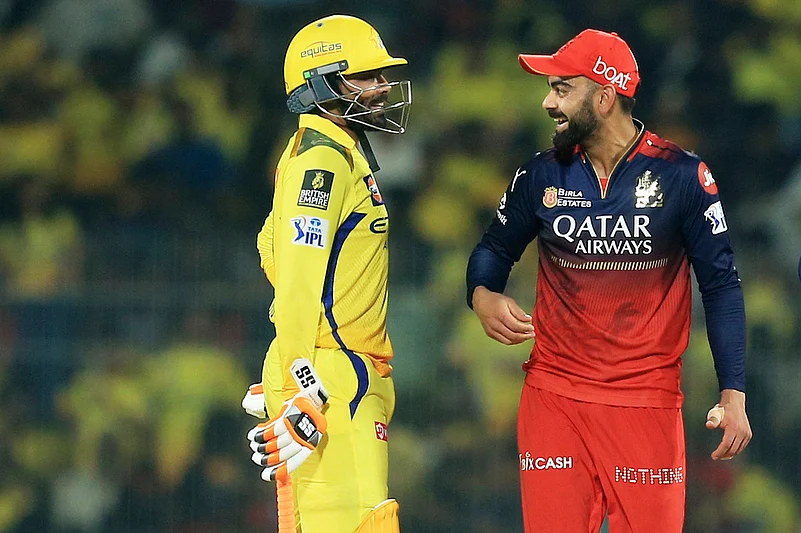 Royal Challengers Bengalurus Virat Kohli, right, and Chennai Super Kings Ravindra Jadeja chat.