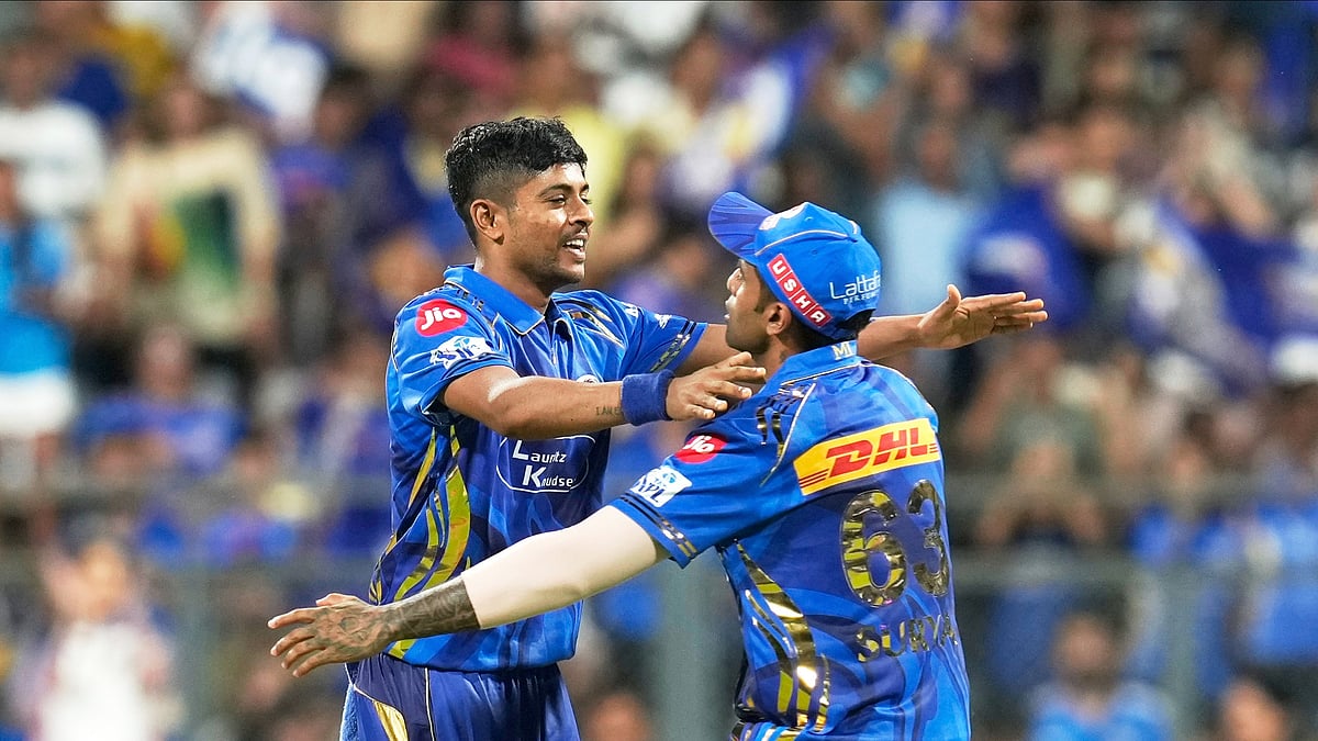 Mumbai Indians Ashwani Kumar, left, celebrates with teammate. AP