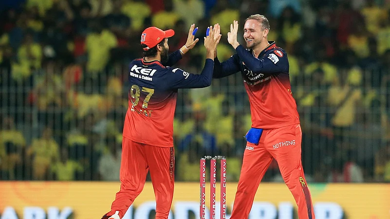Royal Challengers Bengalurus Liam Livingstone, right, celebrates. AP