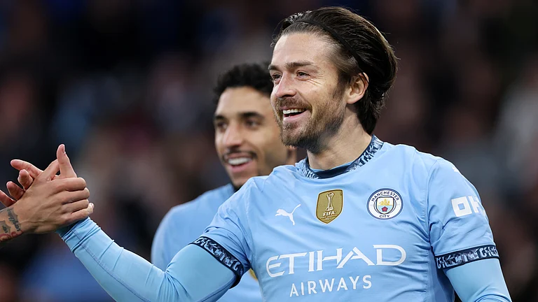 Jack Grealish celebrates after scoring against Leicester City. - null