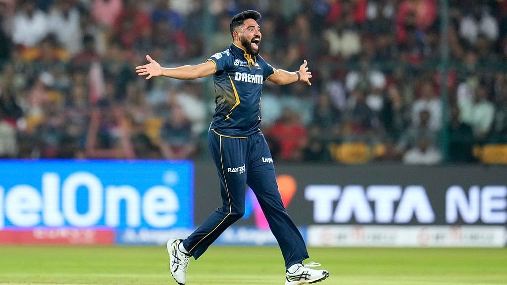AP/Aijaz Rahi : Gujarat Titans' Mohammed Siraj appeals unsuccessfully for the wicket of Royal Challengers Bengaluru's Liam Livingstone during the Indian Premier League cricket match.