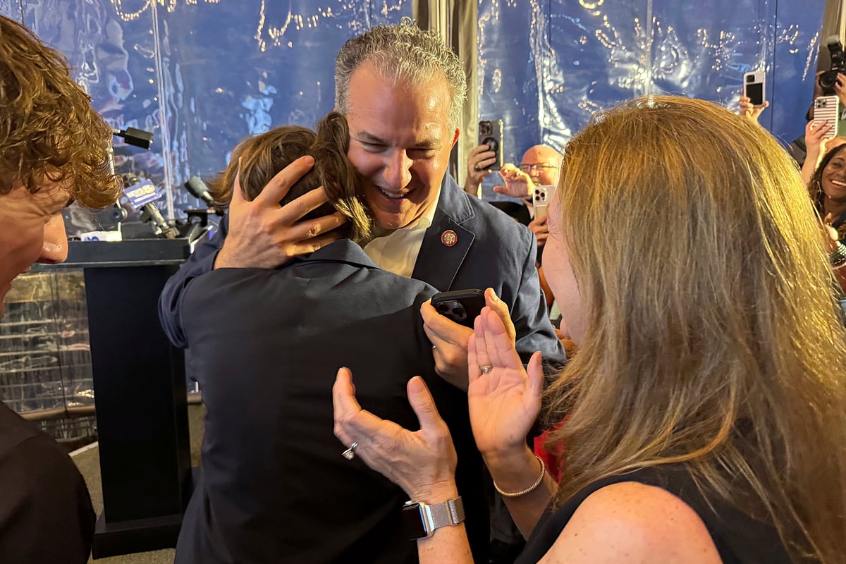 AP Photo/Kate Payne : Republican Jimmy Patronis is congratulated during an election night watch party Tuesday, April 1, 2025, in Pensacola, Fla. 