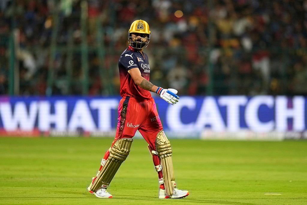 AP/Aijaz Rahi : Virat Kohli walks back to pavilion.
