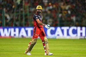 AP/Aijaz Rahi : Virat Kohli walks back to pavilion.