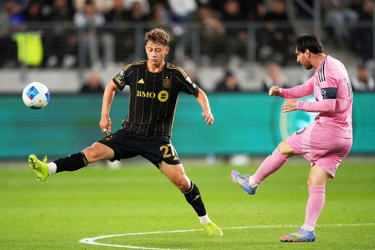 (AP Photo/Mark J. Terrill) : Inter Miami forward Lionel Messi, right, kicks past Los Angeles FC forward Nathan Ordaz during the first half of an MLS soccer match, Wednesday, April 2, 2025, in Los Angeles.
