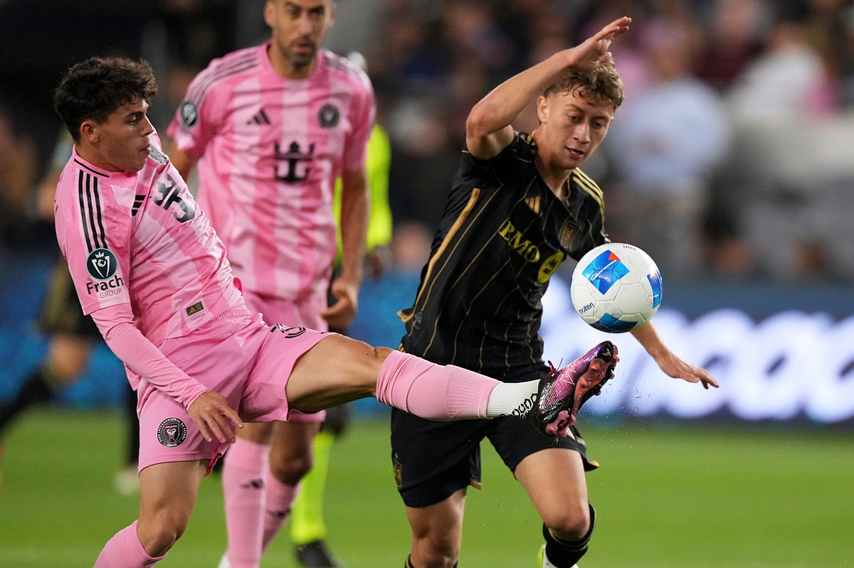 (AP Photo/Mark J. Terrill) : Inter Miami defender Noah Allen, left, kicks the ball in front of Los Angeles FC forward Nathan Ordaz during the first half of an MLS soccer match, Wednesday, April 2, 2025, in Los Angeles.