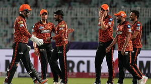 AP Photo/Bikas Das : Kamindu Mendis celebrates after dismissing Angkrish Raghuvanshi.