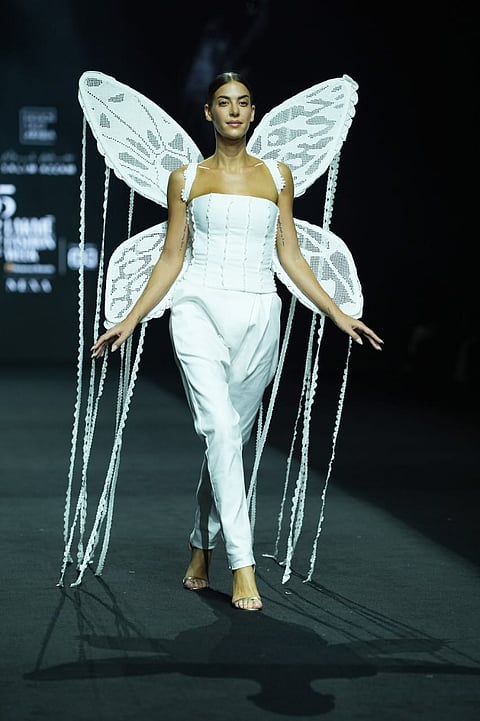 Model presents a creation by Lebanese designer Salim Azzam in association with Fashion Trust Arabia during the Fashion Design Council of India (FDCI) Lakme Fashion Week (LFW) in Mumbai, 29 March 2025.