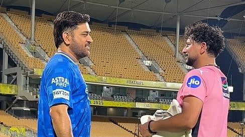 CSKs MS Dhoni with DCs Kuldeep Yadav