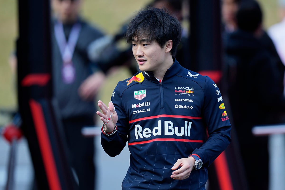 (AP Photo/Hiro Komae)


 : Red Bull driver Yuki Tsunoda of Japan prepares to drive his car during the second practice session for the Japanese Formula One Grand Prix at the Suzuka Circuit in Suzuka, central Japan, Friday, April 4, 2025. 

