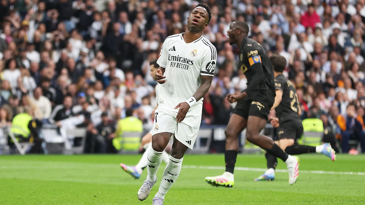 Vinicius Junior reacts to his unsuccessful penalty