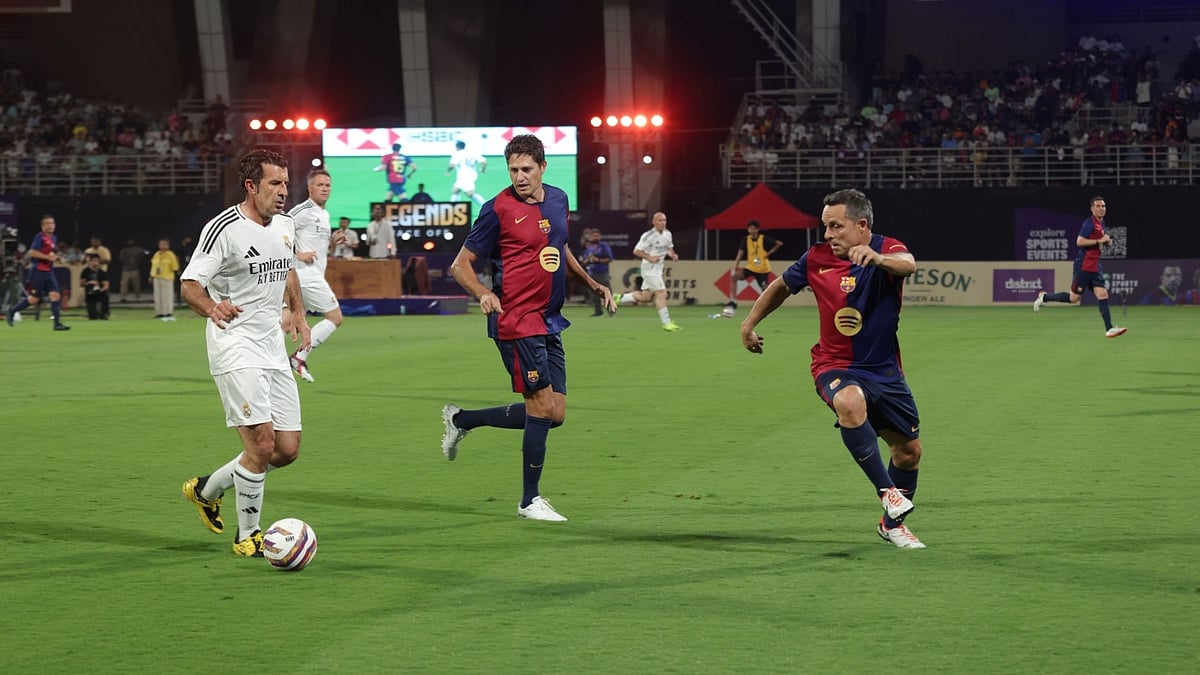 Special Arrangement : Luis Figo (left) in action for Real Madrid Legends against FC Barcelona Legends.