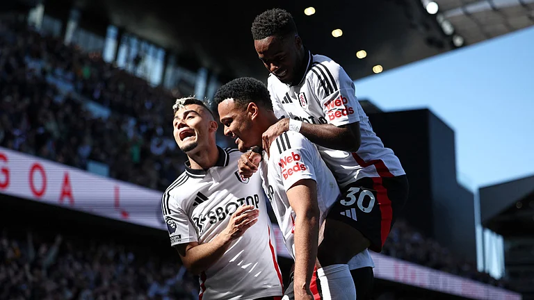 Fulham celebrate Rodrigo Muniz's goal against Liverpool - null