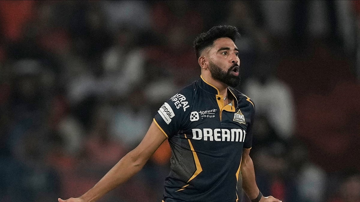 AP Photo/Mahesh Kumar A. : Gujarat Titans' Mohammed Siraj celebrates the wicket of Sunrisers Hyderabad's Simarjeet Singh during the Indian Premier League cricket match between Sunrisers Hyderabad and Gujarat Titans at Rajiv Gandhi International Cricket Stadium in Hyderabad.