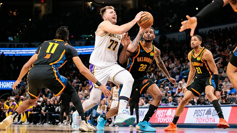 Los Angeles Lakers guard Luka Doncic drives the lane vs. the Oklahoma City Thunder on April 6, 2025. - null