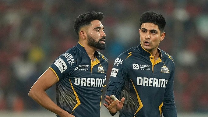 Shubman Gill with Mohammed Siraj. - AP