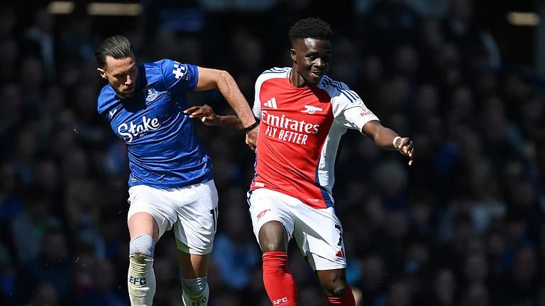 Arsenal's Bukayo Saka in action against Everton. - null