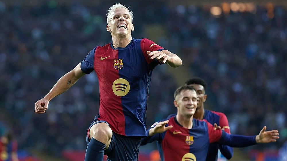 | Photo: AP/Joan Monfort : La Liga 2024-25: Barcelona's Dani Olmo celebrates after scoring his side's third goal