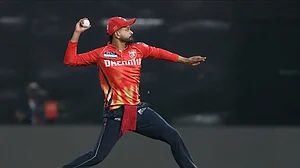 AP Photo/Surjeet Yadav : Punjab Kings' captain Shreyas Iyer throws the ball after fielding during the Indian Premier League cricket match between Punjab Kings and Rajasthan Royals at Maharaja Yadavindra Singh Cricket Stadium in Mohali.
