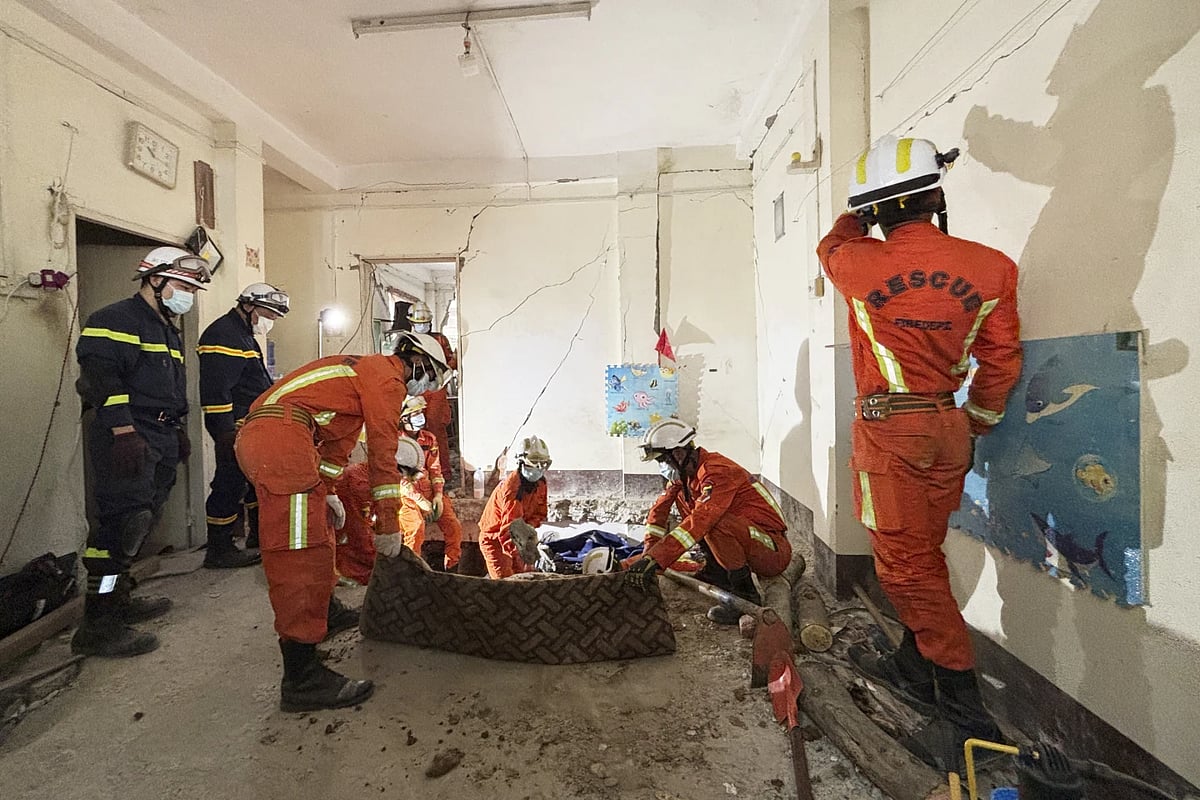 AP : Rescue workers working through rubbles in earthquake-hit Myanmar