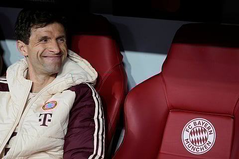 Bayern's Thomas Mueller looks out from the bench prior the Champions League quarterfinals match.