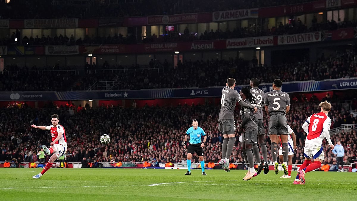 | John Walton/PA via AP : Arsenal's Declan Rice, left, scores his side's opening goal during their UEFA Champions League 2024-25 quarter-final first leg match against visiting Real Madrid at the Emirates Stadium in London on April 8, 2025.