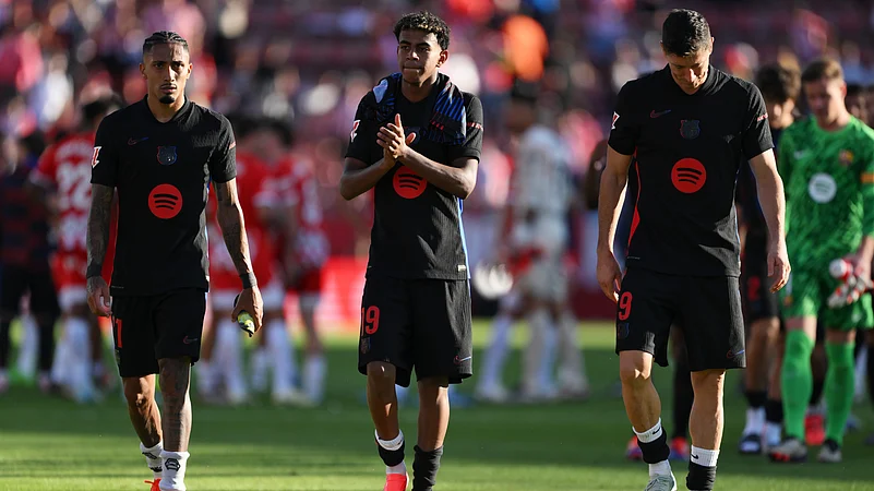 Barcelona forwards Raphinha, Lamine Yamal and Robert Lewandowski