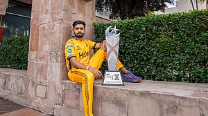 Photo: X | Pakistan Super League : Peshawar Zalmi captain Babar Azam with Pakistan Super League (PSL) trophy.