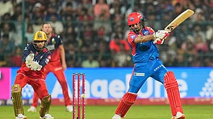 Photo: AP : Delhi Capitals' KL Rahul plays a shot during the Indian Premier League match against Royal Challengers Bengaluru.