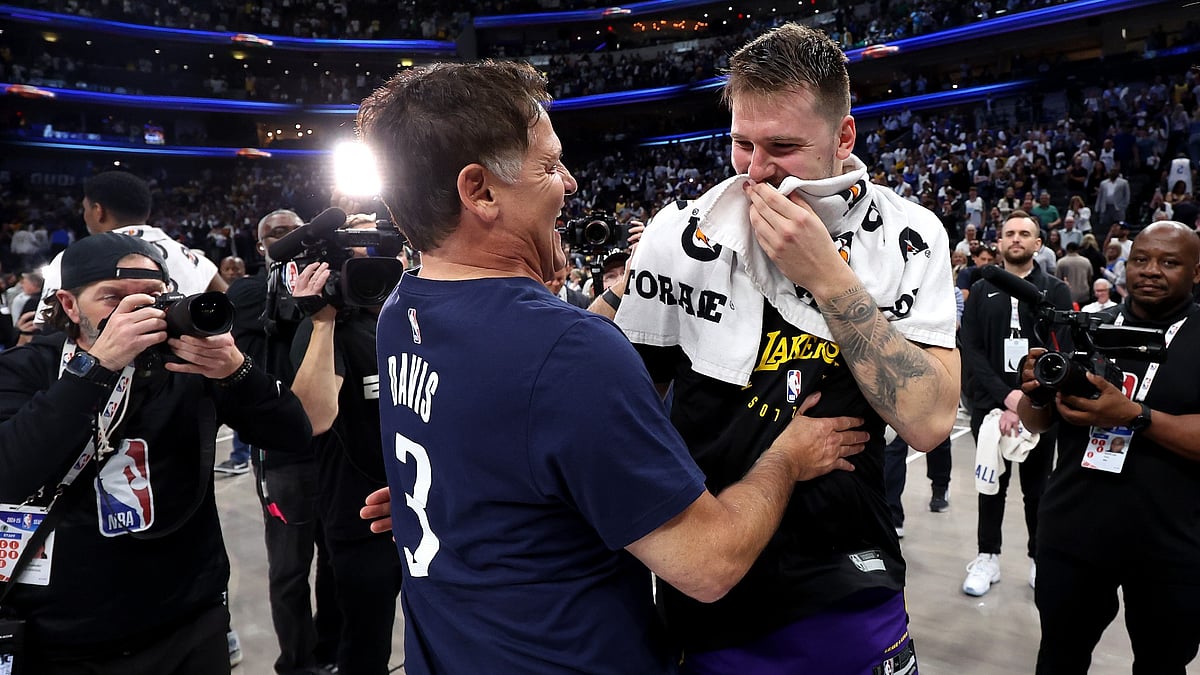 Mark Cuban embraces Luka Doncic #77 of the Los Angeles Lakers after the game against the Dallas Mavericks at American Airlines Center on April 09, 2025 in Dallas, Texas.