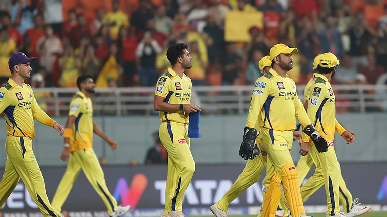 Chennai Super Kings' Mahendra Singh Dhoni, second right, and teammates walk into the field at the start of the Indian Premier League cricket match between Punjab Kings and Chennai Super Kings at Maharaja Yadavindra Singh Cricket Stadium in Mohali. - AP Photo/Surjeet Yadav