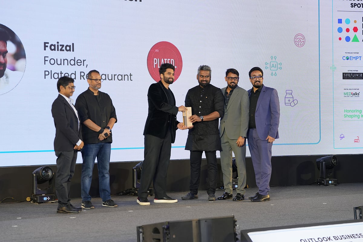 Faizal, Founder, Plated Restaurant receiving the award