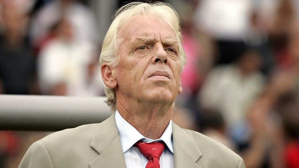 Trinidad and Tobago's coach Leo Beenhakker listens to the national anthems before their World Cup Group B soccer match against England in Nuremberg. - AP