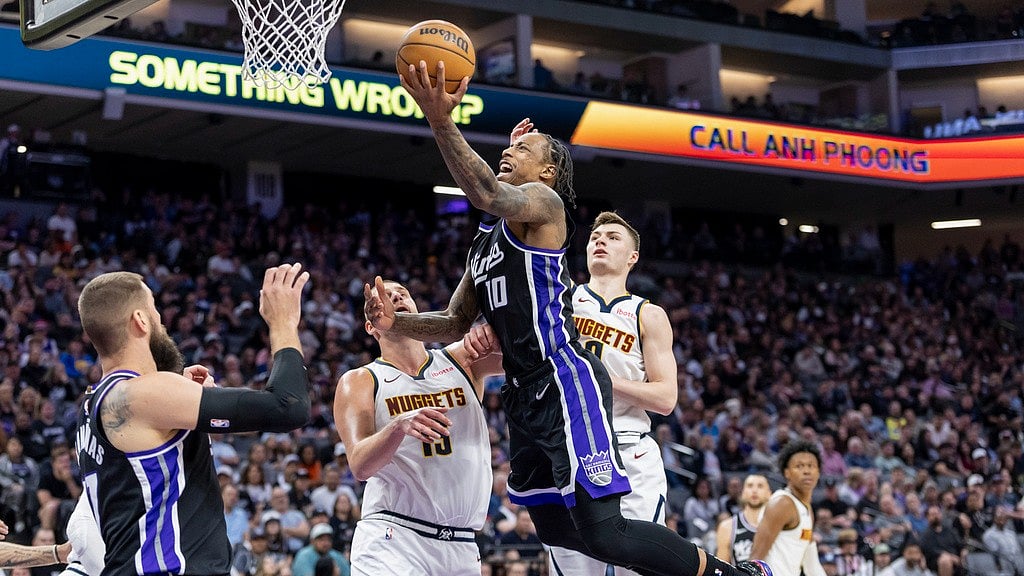 Photo: AP : Sacramento Kings forward DeMar DeRozan (10) goes up for a layup during an NBA game.