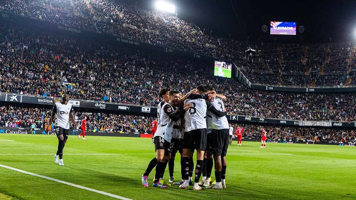 Photo: Valecia : Valencia players celebrate their goal against visiting Sevilla. They won La Liga match 1-0.