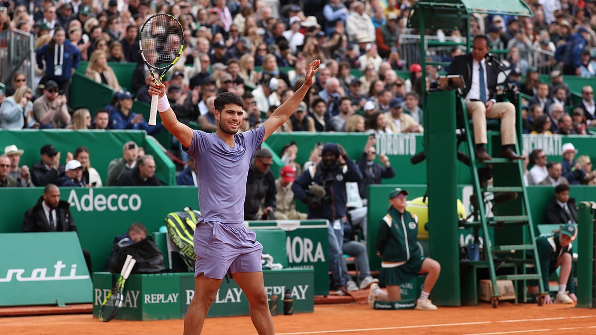 Carlos Alcaraz celebrates after converting match point in Sunday's final
