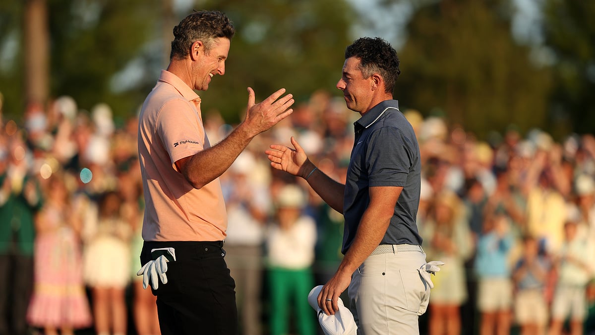 Justin Rose congratulates Rory McIlroy