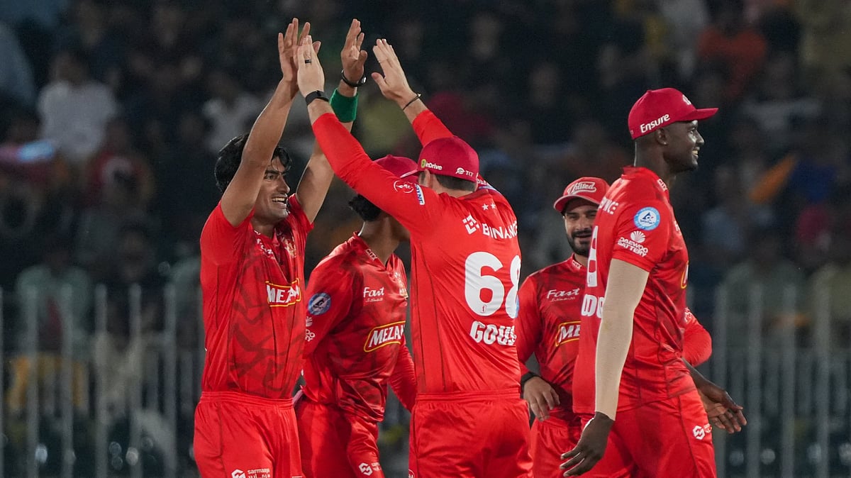 X/Pakistan Super League : Islamabad United celebrate a Peshawar Zalmi wicket during the Pakistan Super League match.