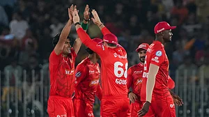 X/Pakistan Super League : Islamabad United celebrate a Peshawar Zalmi wicket during the Pakistan Super League match.
