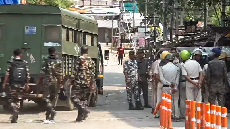 Security forces personnel guard in a violence-hit area, in Murshidabad, West Bengal