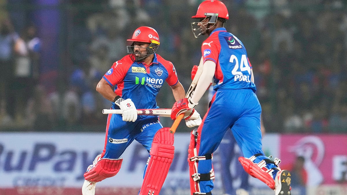  (AP Photo/Manish Swarup)
 : Delhi Capitals' Karun Nair, left, and batting partner Abishek Porel run between the wickets to score during the Indian Premier League cricket match between Delhi Capitals and Mumbai Indians at Arun Jaitley Stadium in New Delhi, India, Sunday, April 13, 2025.

