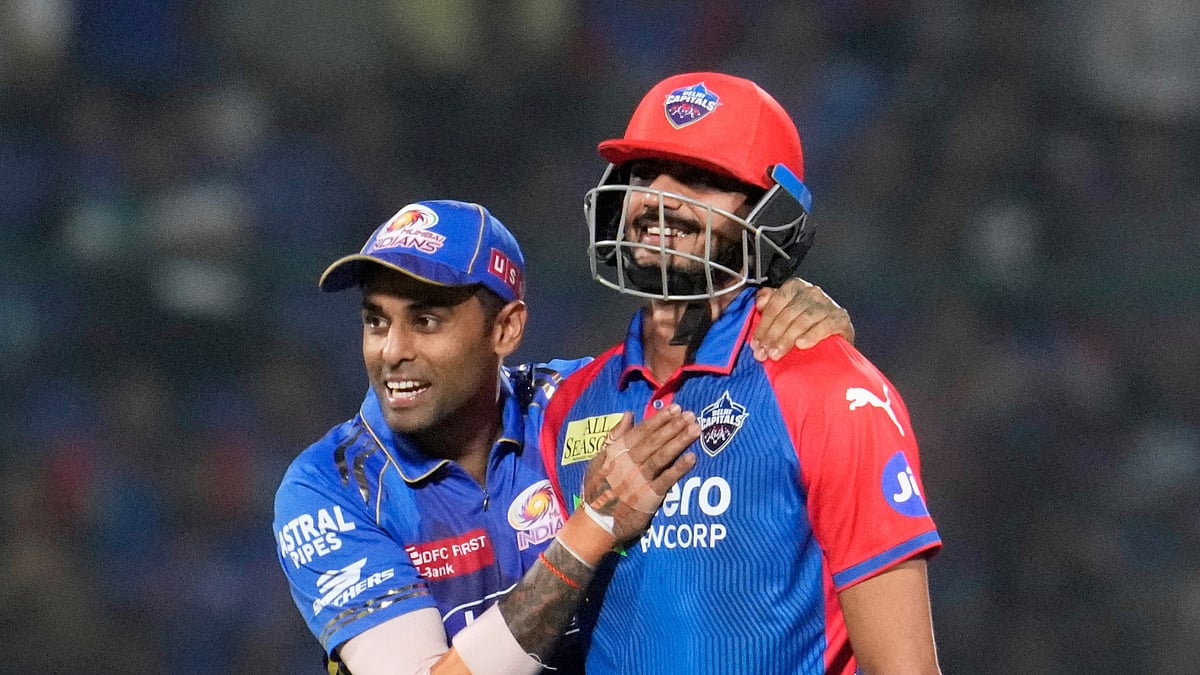 (AP Photo/Manish Swarup)

 : Mumbai Indians' Suryakumar Yadav, left, has a light moment with Delhi Capitals' captain Axar Patel after the latter lost his wicket during the Indian Premier League cricket match between Delhi Capitals and Mumbai Indians at Arun Jaitley Stadium in New Delhi, India, Monday, April 14, 2025. 
