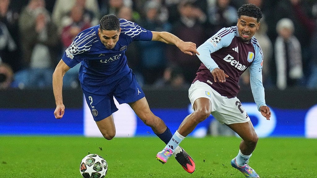 Photo: AP : PSG's Achraf Hakimi, left, challenges for the ball with Aston Villa's Ian Maatsen during the Champions League quarter-final second leg match.