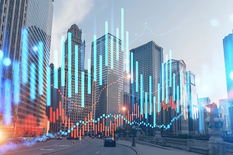 City skyline with financial graph overlay showing real estate and economic growth trends