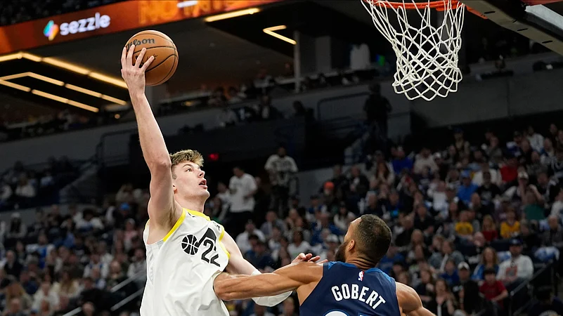 Utah Jazz forward Kyle Filipowski (22) shoots over Minnesota Timberwolves. AP